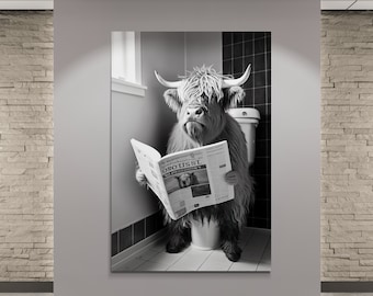 Black and White Highland Cow with Newspaper on toilet Canvas Art - Funny Bathroom Decor. Framed, ready to hang.