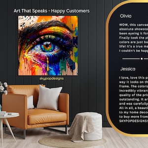 May include: A vibrant canvas print featuring a close-up of a colorful eye with rainbow hues. The artwork is displayed above a leather armchair. Text on the canvas reads "Art That Speaks - Happy Customers" and "skypopdesigns".