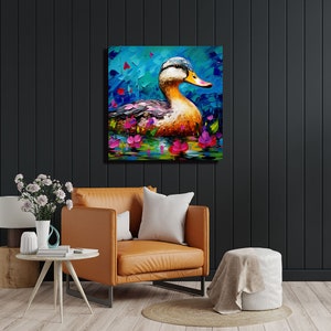 May include: A colourful painting of a duck swimming in a pond with pink flowers. The duck has a yellow beak and a blue head. The background is a blue and green abstract design.