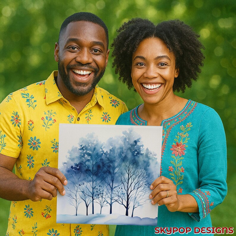 May include: A couple smiles while holding a square watercolor painting of blue trees. The painting has a white border and is set against a green background. The woman wears a teal top with floral embroidery. The man wears a yellow shirt with a floral pattern. The painting has the text "SKYPOP DESIGNS" in the bottom right corner.
