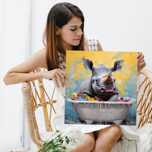 May include: A painting of a rhinoceros taking a bath in a white bathtub. The rhinoceros is gray and has a horn. The bathtub is filled with colorful flowers and water. The background is yellow with blue clouds.
