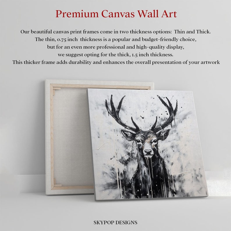 May include: A black and white painting of a deer with large antlers on a canvas print. The canvas is framed with a white wood frame. The frame is 1.5 inches thick. The painting is titled "SKYPOP DESIGNS".