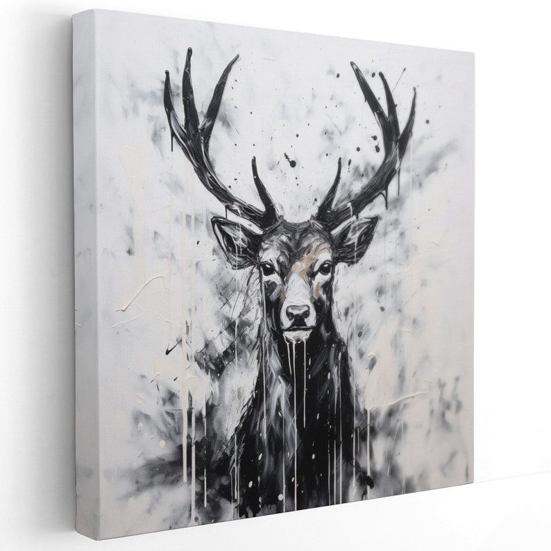 May include: Black and white abstract painting of a deer with large antlers. The deer is facing forward and the background is a splatter of white paint on a gray canvas.