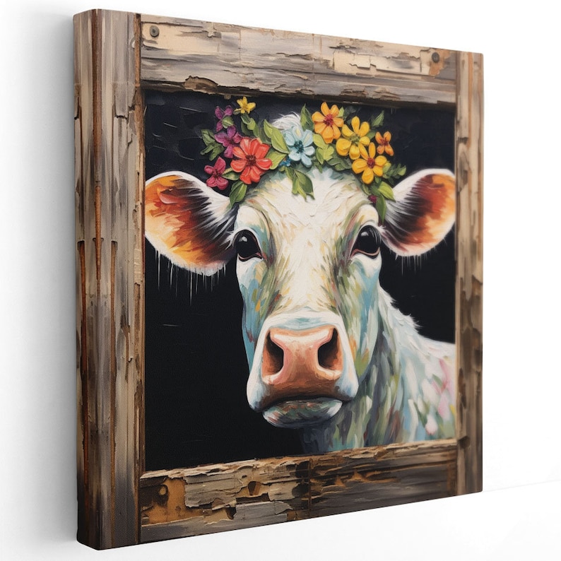 May include: A white cow with a colorful flower crown, painted in a realistic style, framed in a rustic wooden frame.