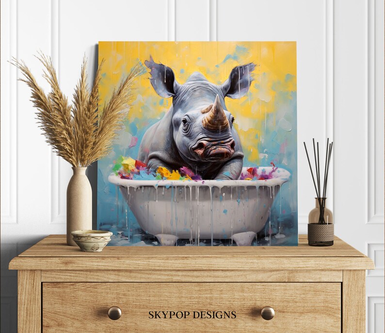 May include: A painting of a rhinoceros taking a bath in a white bathtub. The rhino is gray and has a large horn. The bathtub is filled with colorful water and bubbles. The background is a yellow and blue abstract design.