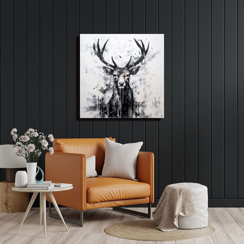 May include: A black and white painting of a deer with large antlers. The deer is facing forward and has a serious expression. The background is a white canvas with splatters of paint.