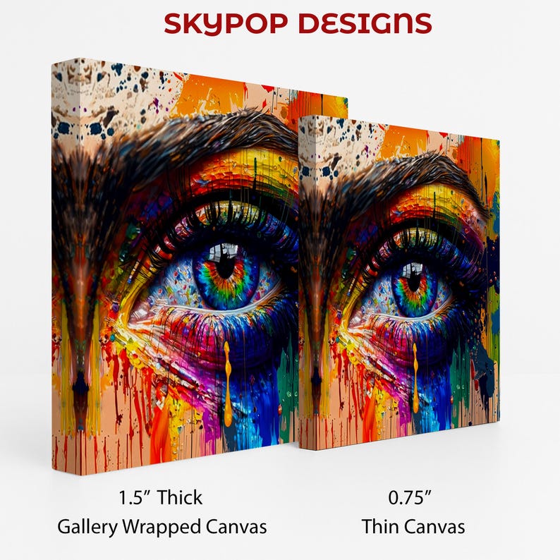 May include: Two canvas prints of a colorful eye with rainbow hues in the iris and dripping paint effects. The text "SKYPOP DESIGNS" is at the top. One canvas is 1.5" thick, gallery wrapped, and the other is 0.75" thin canvas.