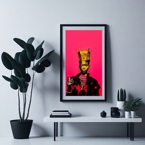 May include: A framed print of a woman wearing a gold crown and jewellery, with a pink background.