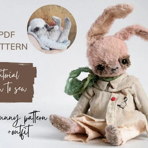 May include: A pink bunny rabbit teddy bear wearing a white shirt with a red button and a green scarf. The bunny is sitting on a white surface. The image also includes text that says "PDF PATTERN", "Tutorial how to sew", and "Bunny pattern + outfit".