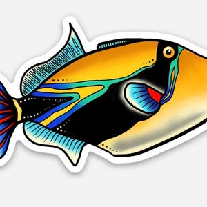 May include: A colorful sticker featuring a stylized fish with a vibrant design. The fish has a yellow body, black accents, and blue and red details on its fins and tail. The sticker has a white border.