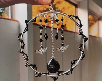 Nocturnal Creatures suncatcher