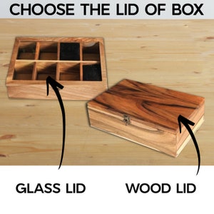 Pode incluir: S&atilde;o exibidas duas caixas de madeira, uma com tampa de vidro e compartimentos, a outra com tampa de madeira e fecho. O texto "CHOOSE THE LID OF BOX" est&aacute; no topo, com "GLASS LID" e "WOOD LID" em baixo.