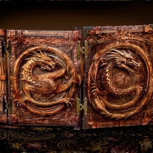 May include: A four-panel, intricately carved wooden book cover with a dragon design. Each panel features a golden dragon coiled around a circular motif. The book cover is closed, revealing the intricate details of the carvings.
