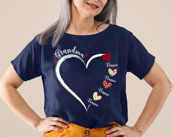 May include: Navy blue t-shirt with a white heart and the word "Grandma" above it. Inside the heart are four smaller hearts with the word "Name" written below each.