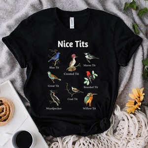May include: Black t-shirt with a humorous design featuring different types of birds with the text "Nice Tits" and the names of each bird.