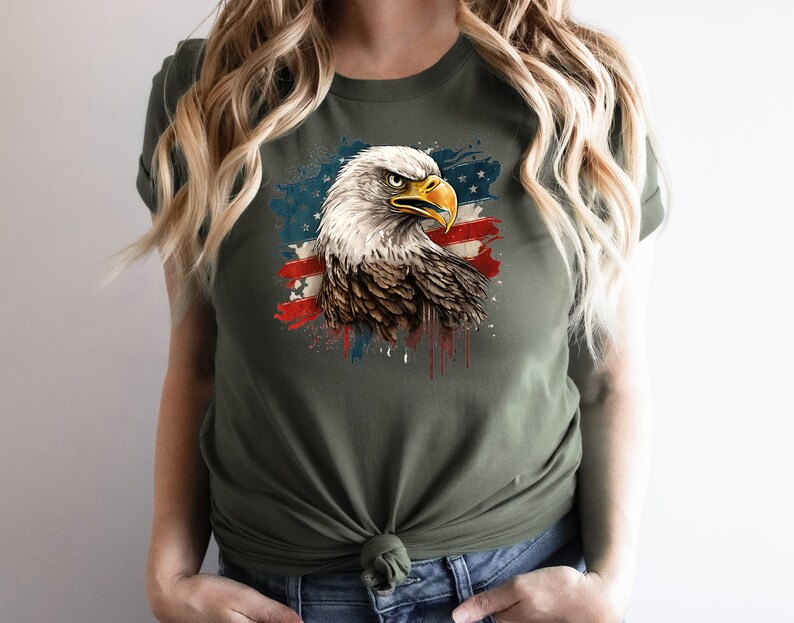 May include: A green t-shirt with a graphic of a bald eagle with a red, white, and blue American flag in the background.