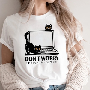May include: White t-shirt with a black cat on a laptop and the text "Don't Worry I'm From Tech Support".