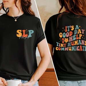 May include: Black t-shirt with a colorful retro design that says "SLP" on the front and "It's a good day to help tiny humans communicate" on the back.