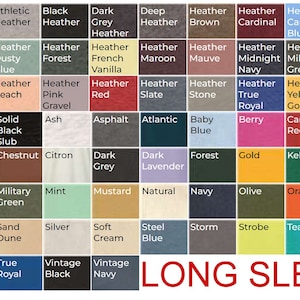 May include: A color chart of long-sleeve t-shirt colors. The chart includes a variety of colors, including solid colors, heather colors, and slub colors. The chart also includes the text "LONG SLEEVE".
