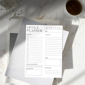 May include: A black and white printable office planner with sections for schedule, to-do list, notes, daily reflection, and top priorities. The planner has a simple design with a title that reads "Office Planner".
