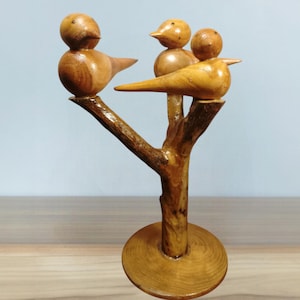 Bird sculpture on branch