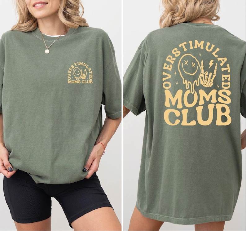 a woman wearing a green tshirt with a yellow mom's club logo