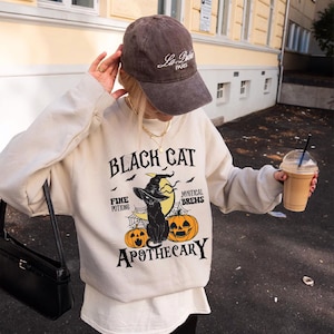 Black Cat Apothecary Sweatshirt and Hoodie, , Halloween Black Cat Hoodie, Cat Lover Hoodie, Retro Halloween, Witchy Cat Halloween,L410