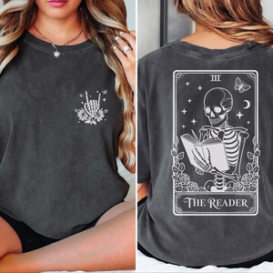 The image is a collage of two photos. The left photo shows a woman wearing a black t-shirt with a graphic design on the front, while the right photo shows the back of the same t-shirt with a graphic design depicting a skeleton reading a book.