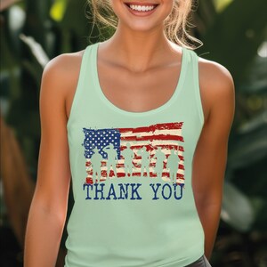a woman wearing a tank top with an american flag on it