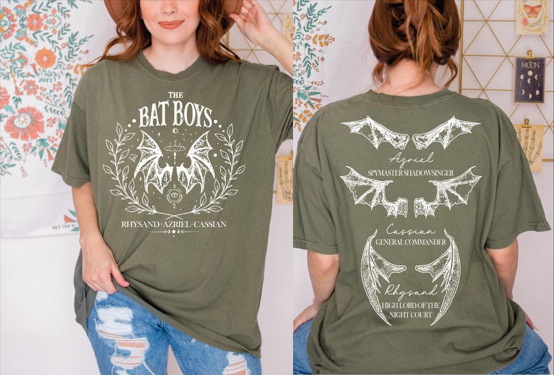 a woman wearing a bat box t - shirt