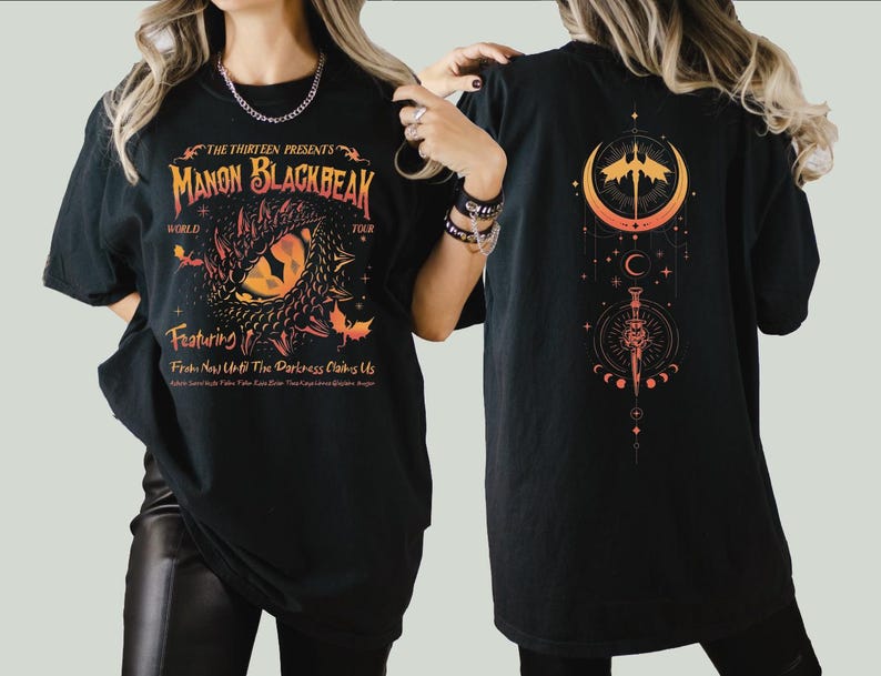 a woman wearing a black shirt with a dragon on it