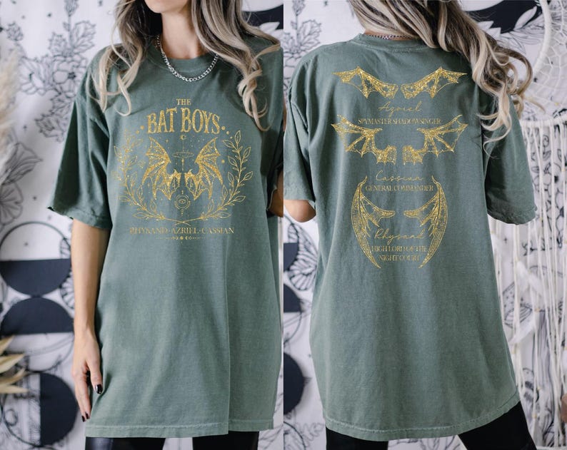 a woman wearing a green bat boy shirt