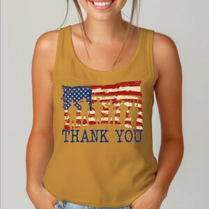 a woman wearing a tank top with an american flag on it