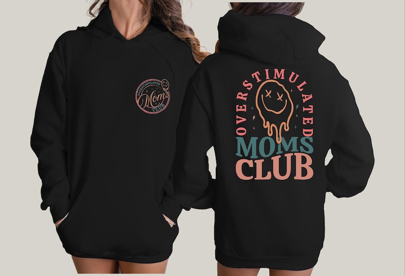 a woman wearing a black hoodie with a lion on it