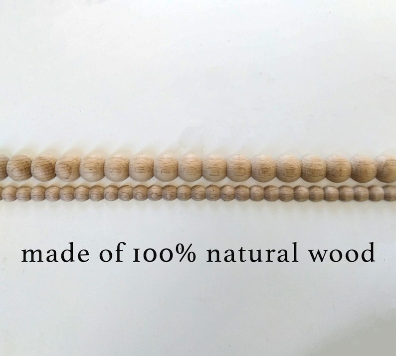 Three strands of natural wood beads in varying sizes