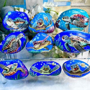 Sea Turtle Painted Rock. Gentle sea turtle beckon to you in the beautiful underwater world.
