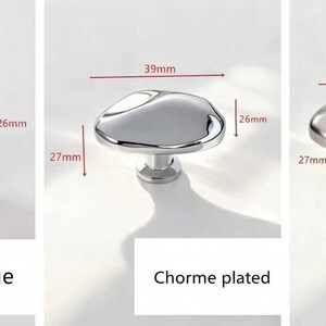 May include: Three cabinet knobs in antique, chrome-plated, and matte brushed finishes. Each knob has a unique, organic shape, with dimensions of 39mm length, 26mm width, and 27mm height. The antique knob is bronze, the chrome-plated is silver, and the matte brushed is silver.