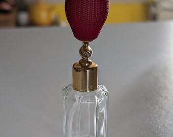 Vintage perfume bottle with working red atomizer pump