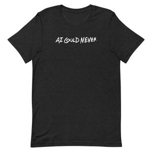 May include: Dark gray t-shirt with the white text "AI COULD NEVER" in a handwritten style across the chest. The shirt has short sleeves and a crew neck.