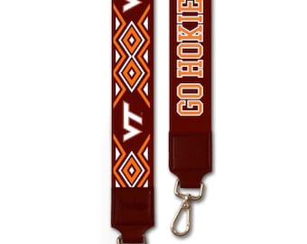 May include: A maroon lanyard with a white and orange geometric pattern and the text "VT" on one side and the text "GO HOKIES" on the other side.