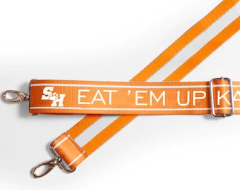Sam Houston EAT 'EM UP - verstelbaar riempje, licentie, patroon, crossbody, achterklep, stadiongoedgekeurd, afstudeercadeau, terug naar school