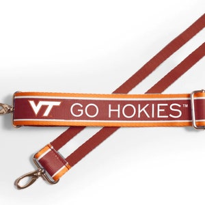 May include: A maroon and orange striped strap with the text "VT GO HOKIES" in white. The strap has two gold metal clasps.