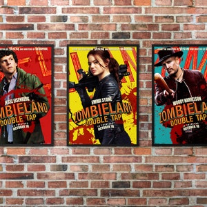 May include: Three movie posters for the film "Zombieland: Double Tap". Each poster features a different actor from the film: Jesse Eisenberg, Emma Stone, and Woody Harrelson. The posters are all red, yellow, and blue with a black border.