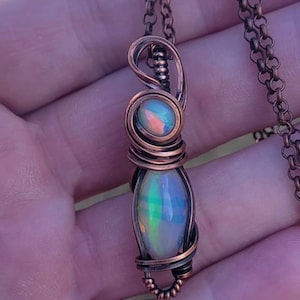 2 Ethiopian opals wire wrapped in a Copper Pendant.