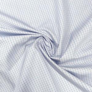 May include: A white fabric featuring a fine grid pattern composed of thin, intersecting blue lines. The material is gathered in the center, creating soft folds and drapes that highlight the geometric check design across the surface.
