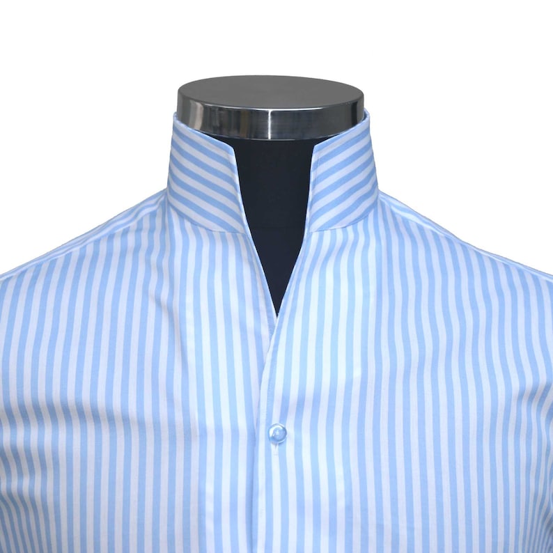 May include: A light blue striped dress shirt with a mandarin collar.
