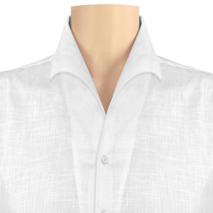 May include: A white linen shirt with a wide collar and a button fastening.