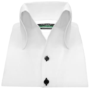 May include: White dress shirt with a button-down collar and black buttons. The shirt has a label that reads "John Clothier London Green Label 100% Cotton."