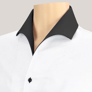 May include: A white collared shirt with a black collar.