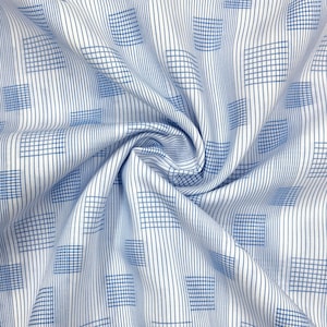 May include: White fabric with a blue grid and vertical stripe pattern. The fabric is gathered and folded, creating a textured appearance. The design features a repeating pattern of blue squares and lines.